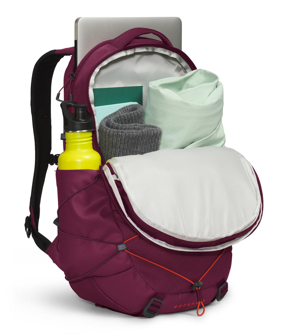 The North Face Borealis pockets close-up emphasizes secure zips and fleece-lined space.