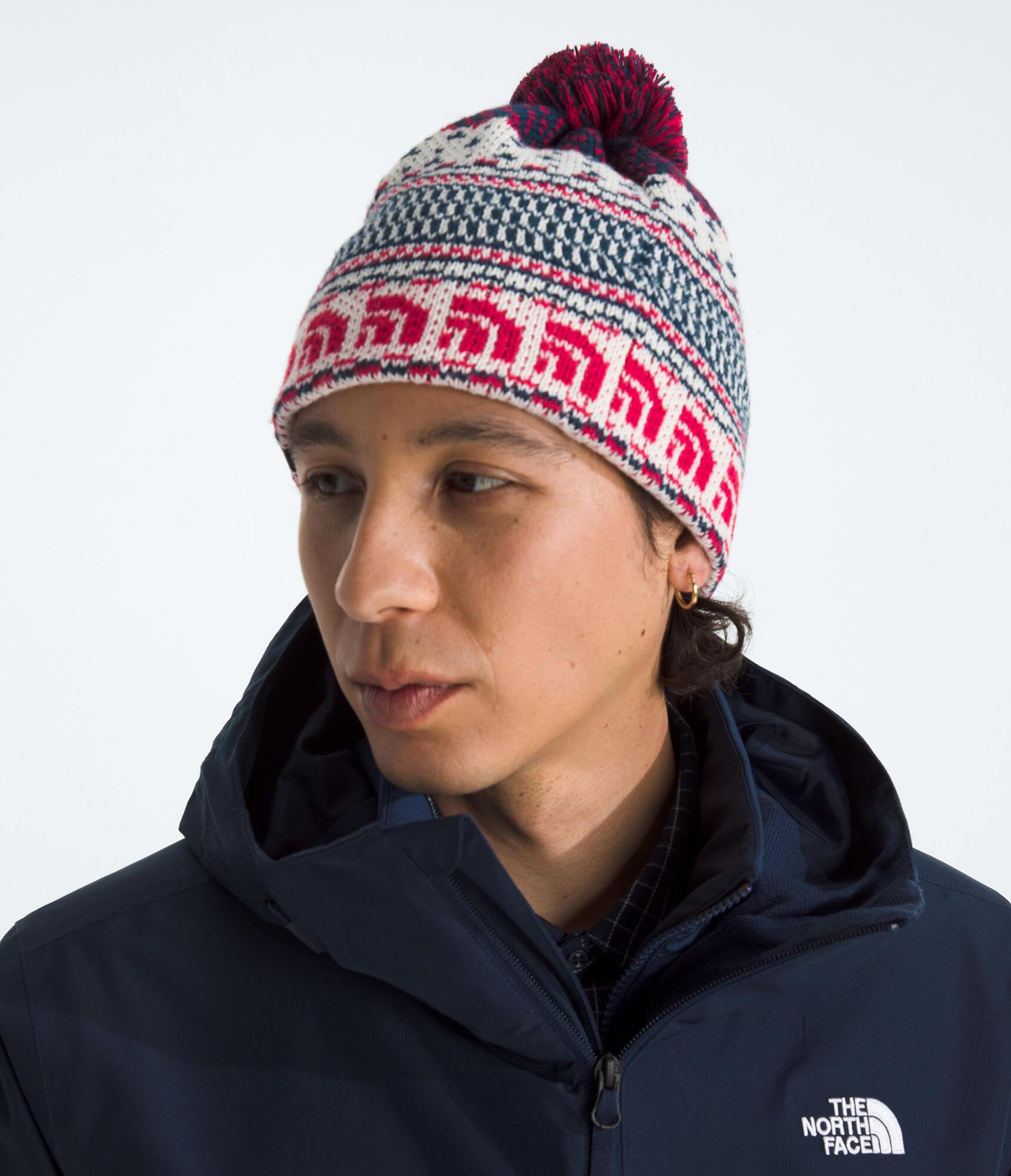 The North Face Cabin Ski Tuke jacquard texture highlights retro style for everyday casual wear.