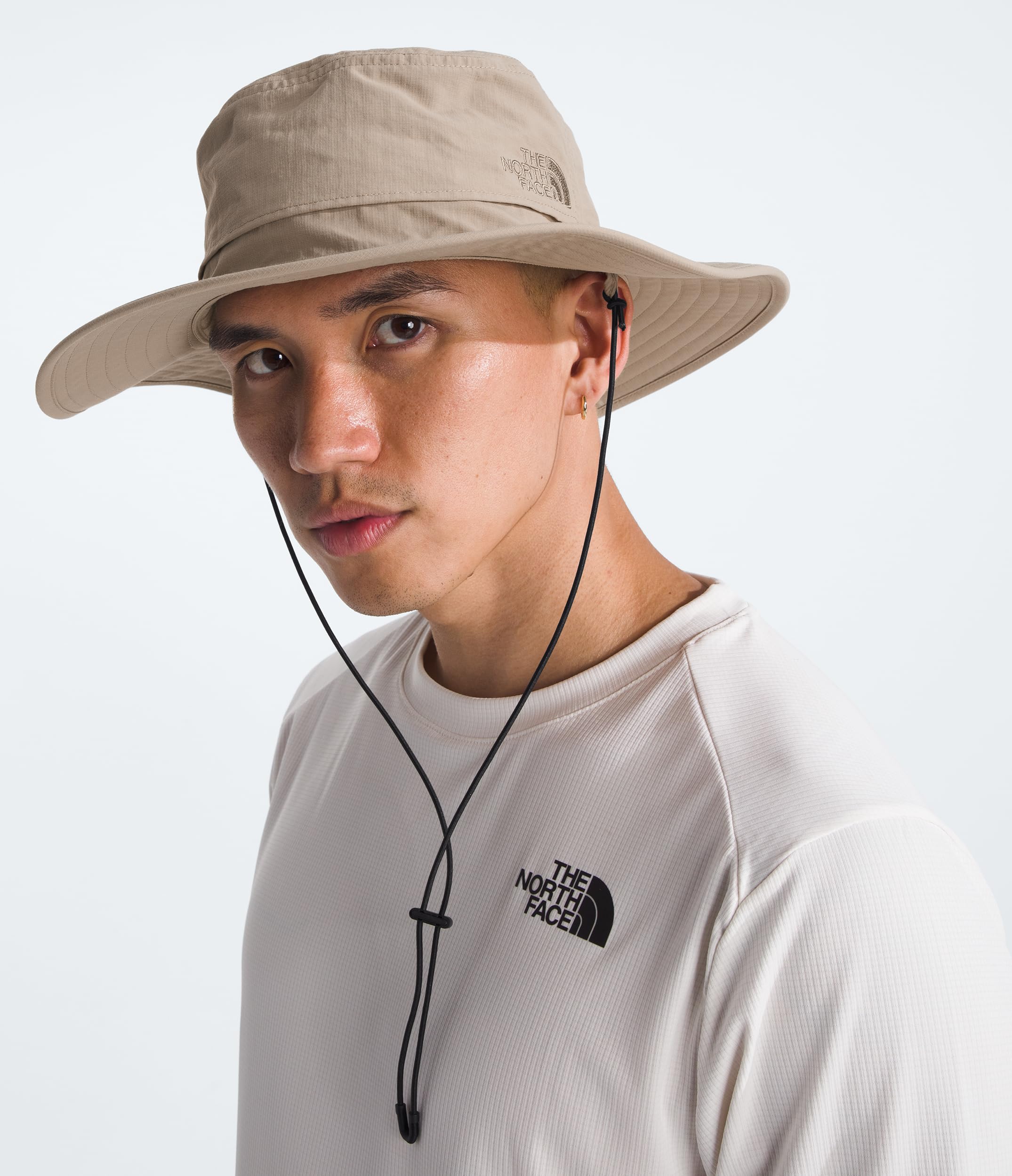 The North Face Horizon Breeze Brimmer hat side view with adjustable chin strap for secure fit.