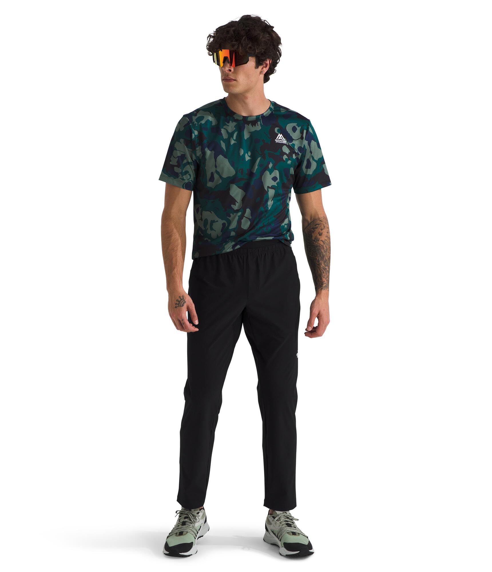 The North Face men's jogger shows tailored fit through the thigh for versatile wear.