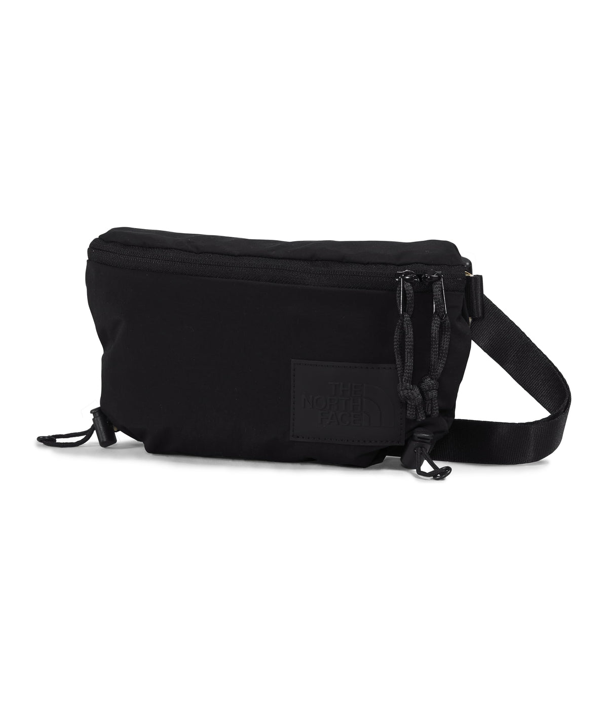 The North Face Never Stop Lumbar front view highlights compact city carry.