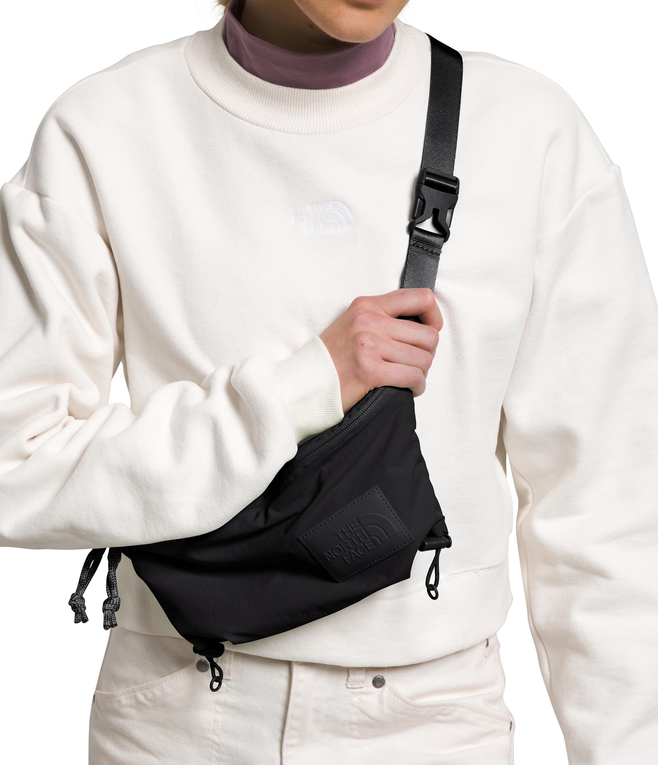 The North Face Never Stop Lumbar in-use on city streets for hands-free convenience.