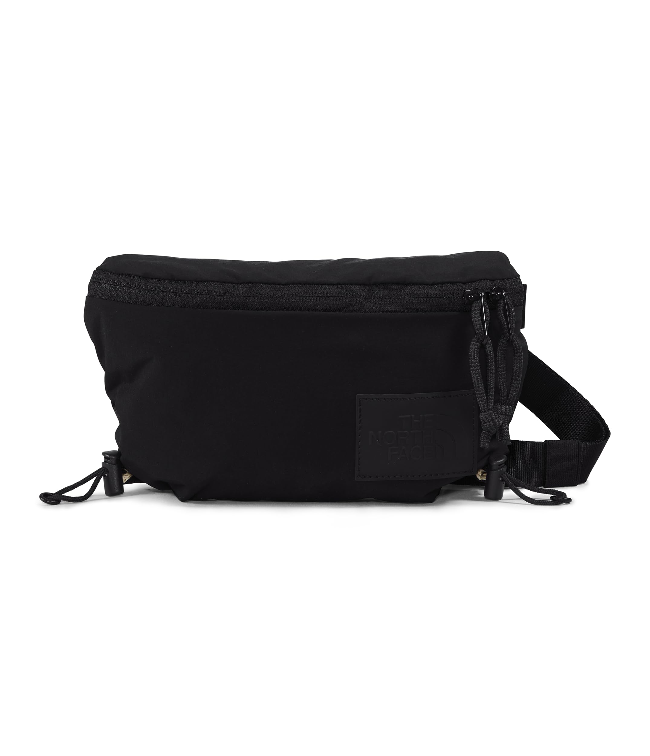 The North Face Never Stop Lumbar top-zip closure for quick access.