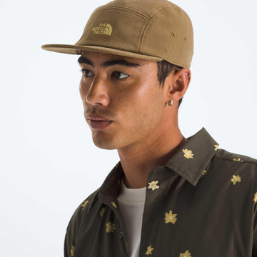 Front logo of The North Face Norm Camp Hat in cedar, ready for outdoor adventures.