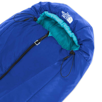 The North Face Teen Stormbreak 20F compression sack demonstrates easy packing and transport.