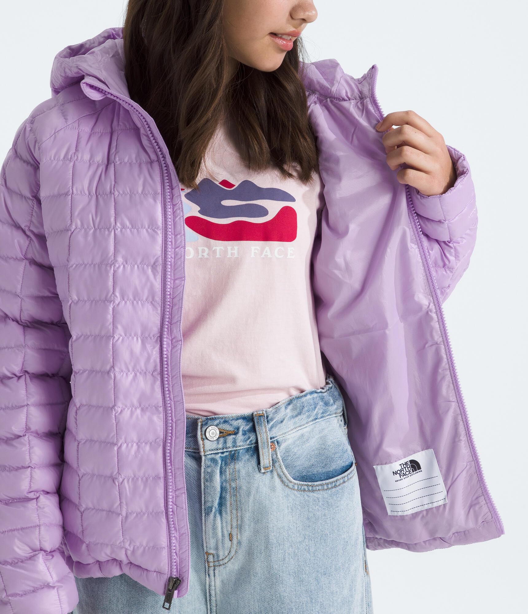 The North Face Teen Thermoball Jacket ripstop fabric close-up highlights durable weather-ready material.
