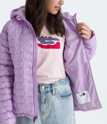 The North Face Teen Thermoball Jacket ripstop fabric close-up highlights durable weather-ready material.