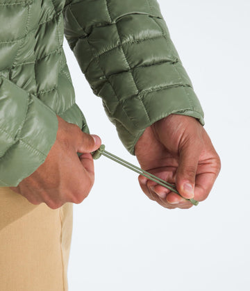 The North Face Thermoball Hooded Jacket Bark Mist color offers wind-ready style and warmth.