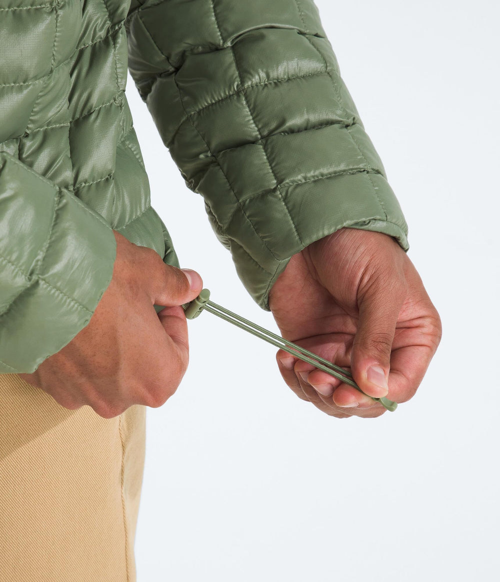 The North Face Thermoball Hooded Jacket Bark Mist color offers wind-ready style and warmth.