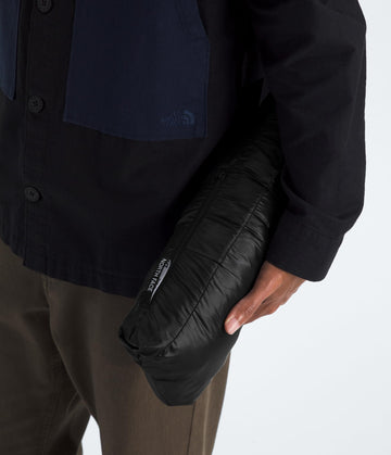 The North Face Thermoball Hooded Jacket packs into its pocket for easy carry