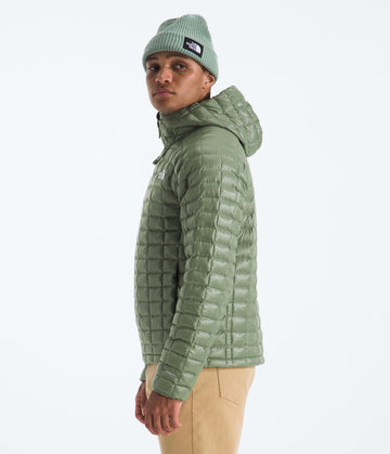 The North Face Thermoball Hooded Jacket side profile showing compact, packable design for travel.