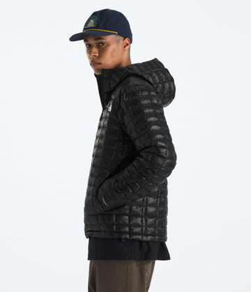 The North Face Thermoball Hooded Jacket side view highlights a sleek, mobile fit for hassle-free layering