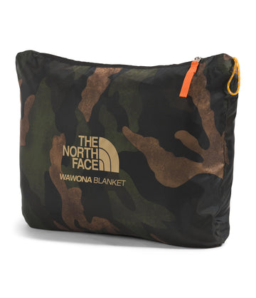 The North Face Wawona Blanket spread on a bed highlights home comfort.