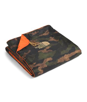 The North Face Wawona Blanket at a campsite demonstrates water-repellent protection.