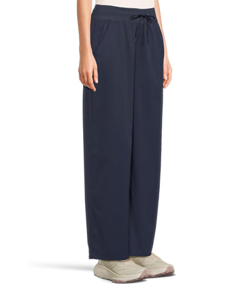 The North Face Aphrodite Arise wide-leg pant fabric close-up highlights four-way stretch for mobility.
