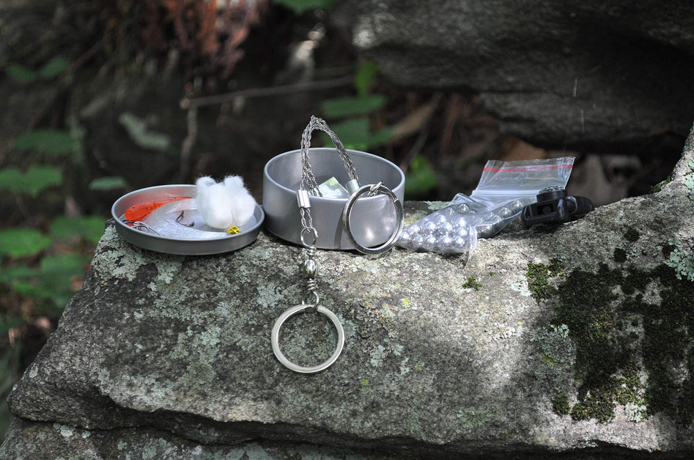 The Pocket Shot Survival Kit fishing gear setup ready for improvised meals in the field.