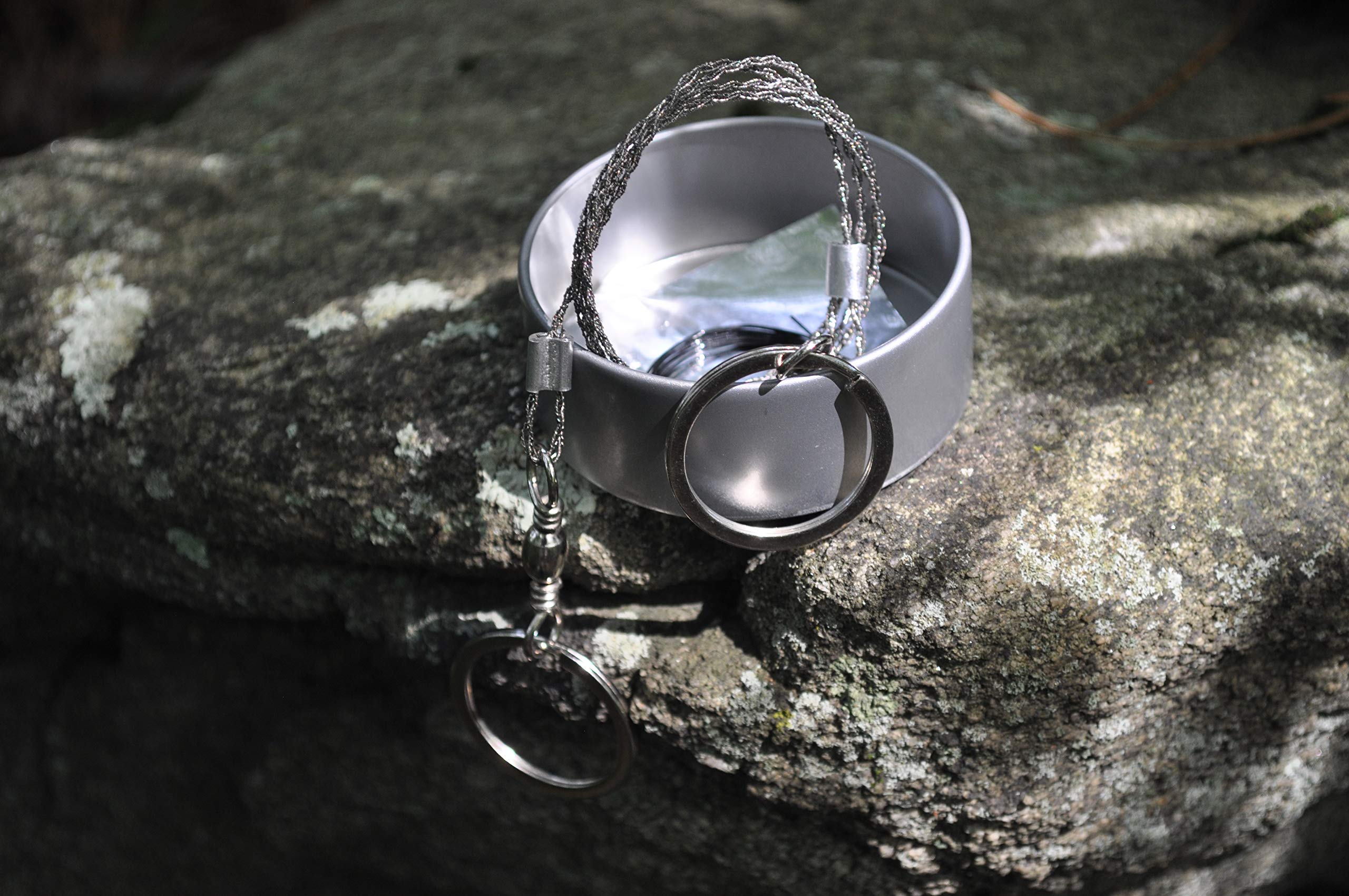 The Pocket Shot Survival Kit compass and wire saw in action for navigation prep.