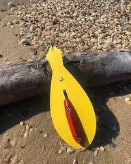 The Reliable Spoon 8" Bunker Spoon in action attracts fish with its treble-hook design.