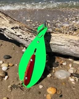 The Reliable Spoon 8-inch Bunker Spoon lime green highlights trailing treble hook stability for catching striped bass.