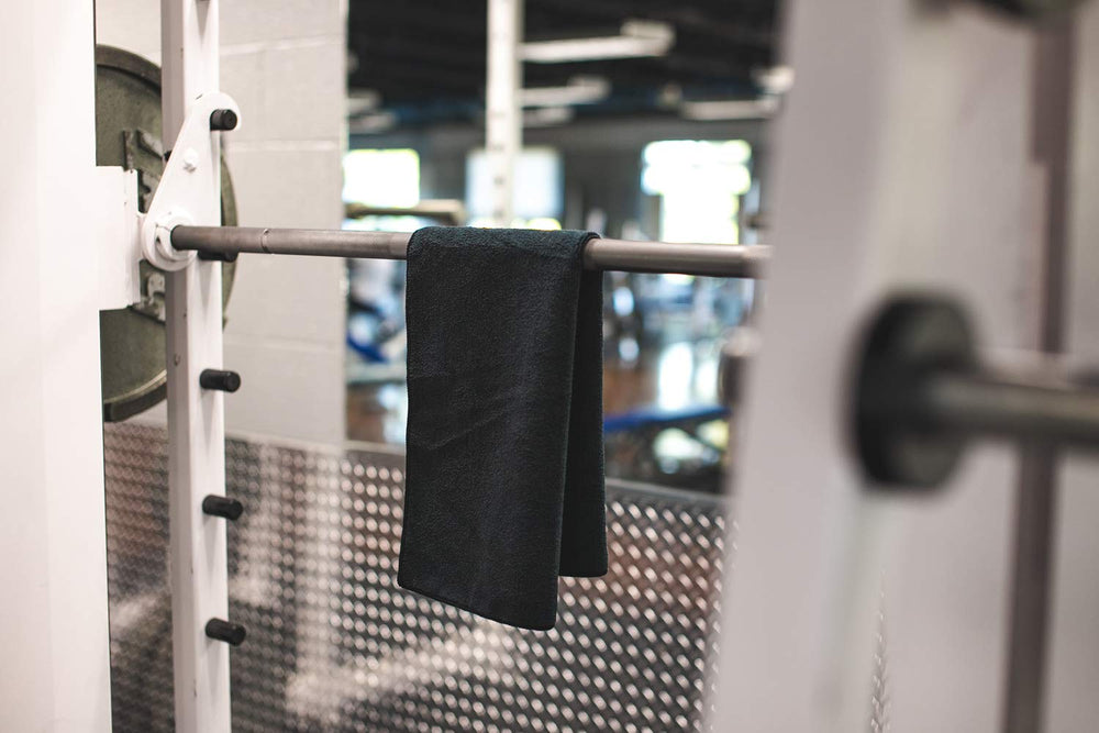 The Rag Company towel midnight used to clean gym equipment after workouts.