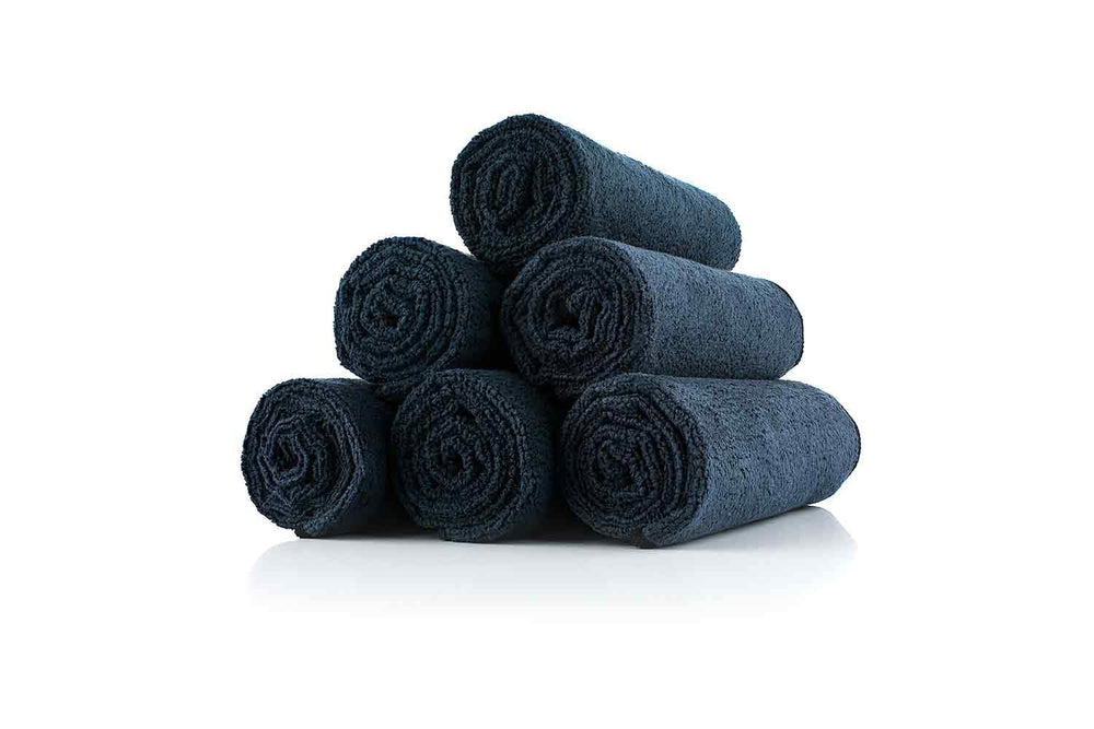 The Rag Company towel midnight used to wipe sweat during workouts and classes.