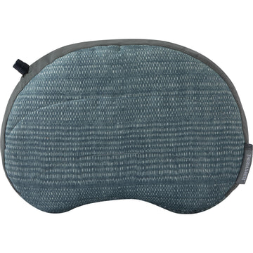 Therm-a-Rest Air Head Pillow in blue cover offers soft comfort for camping and travel.