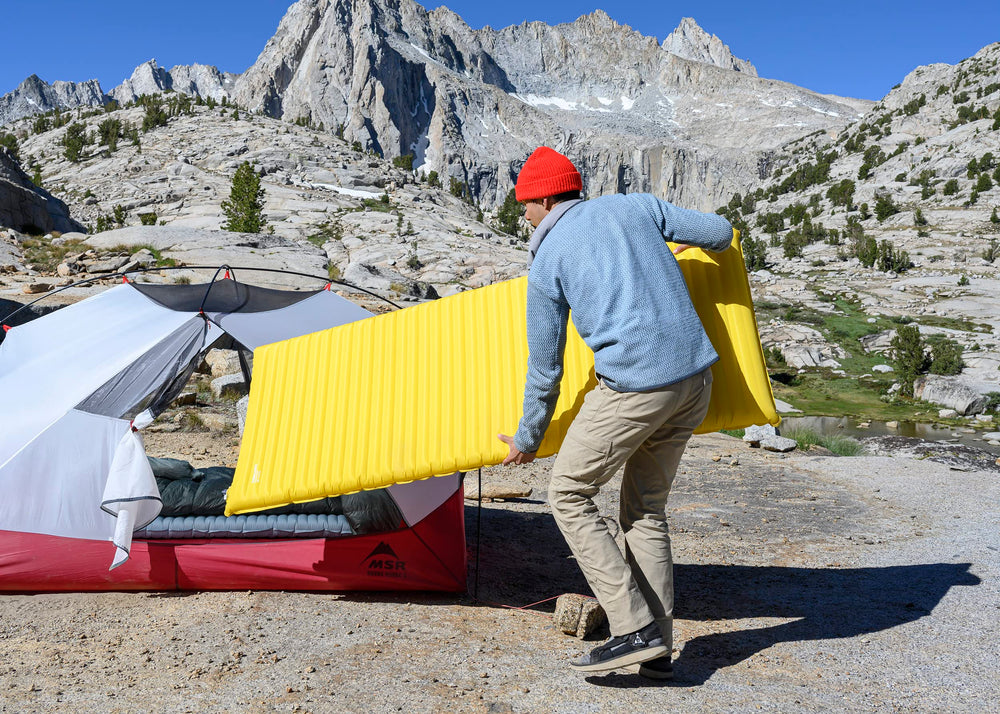 NeoAir XLite NXT MAX packed compactly for backpacking in Solar Flare