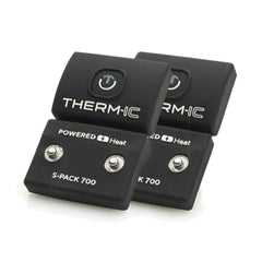THERM-IC S-Pack 700 sock batteries held in hand, delivering portable warmth for winter outdoor activities.