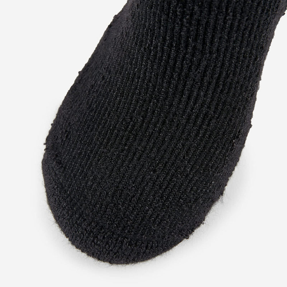 Over-the-calf design supports leg coverage and secure fit under gear.