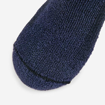 Thorlos men's hiking moderate cushion low cut, sole texture, moisture-wicking feet during rugged trails.