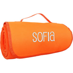 Threadart personalized embroidered blanket with carrying strap for easy travel at events.
