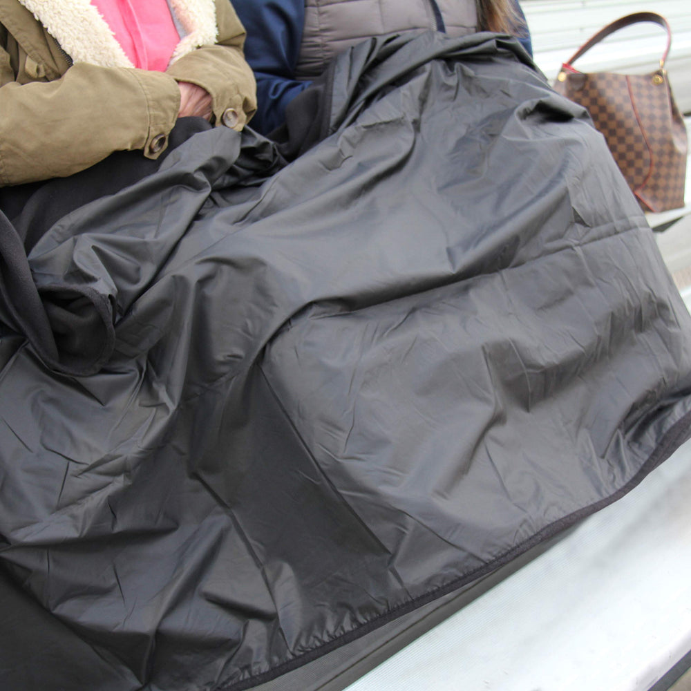 Threadart roll-up blanket with carry bag demonstrated for easy portability