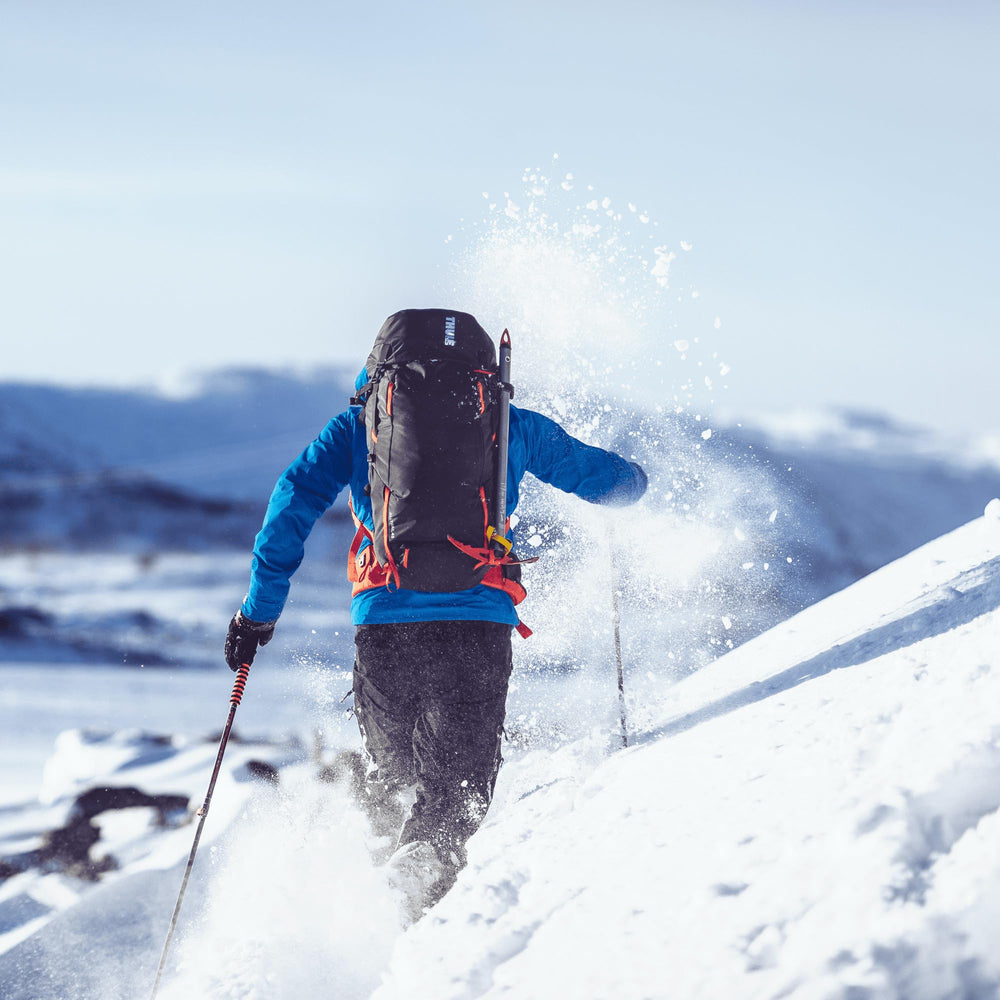 Thule Alltrail trekking pole holder keeps gear ready on the hip.