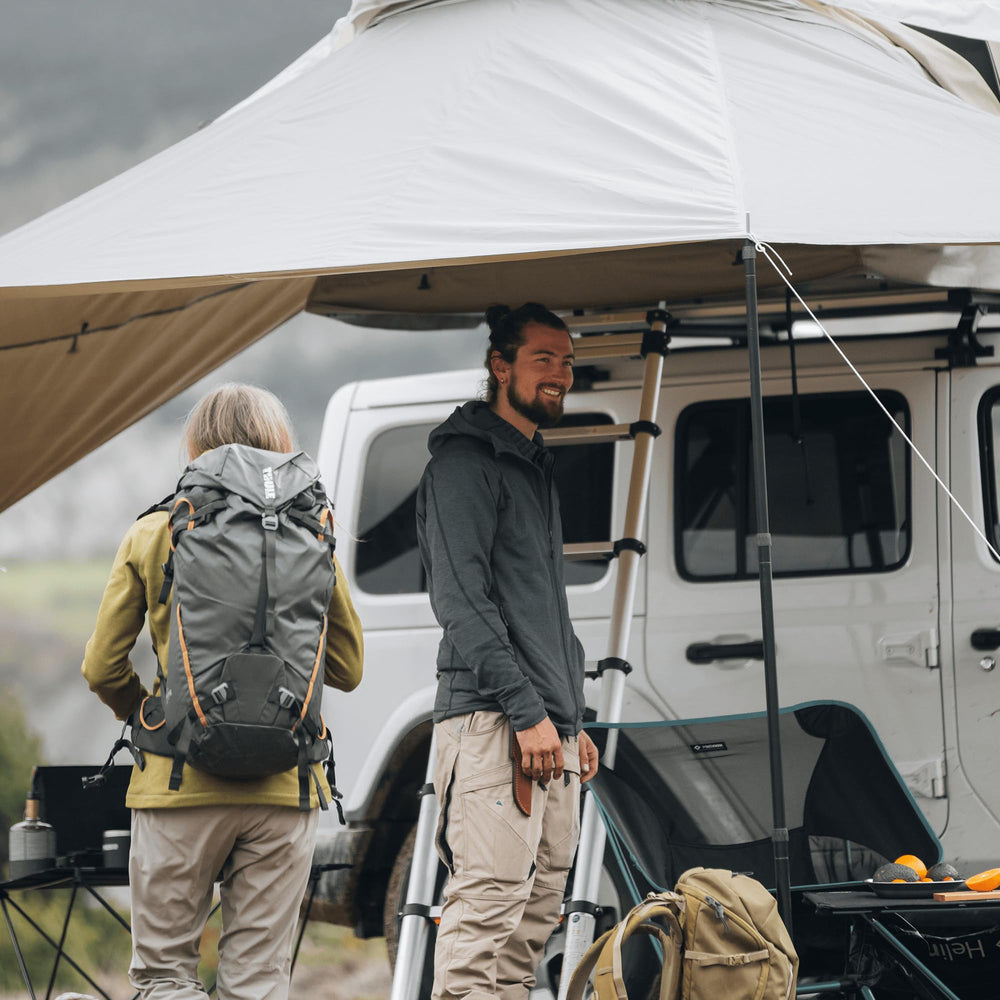 Thule Approach Awning S/M gray shaded patio area beside the tent