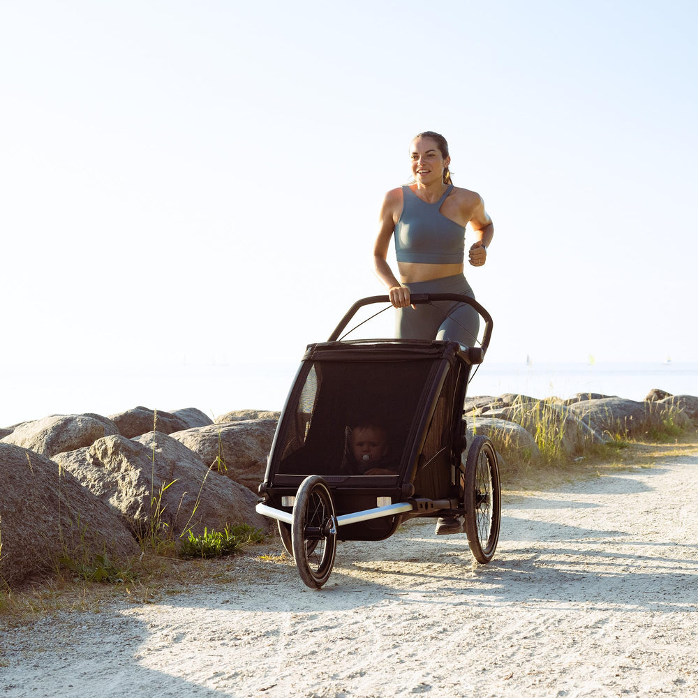 Thule Chariot jogging kit demonstrates compatibility with Cross 2 Double and Sport 2 Double.