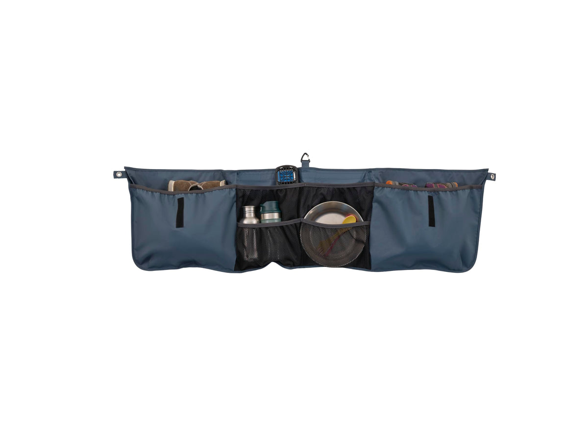 Thule Outset Organizer waterproof compartments protect gear in wet conditions.