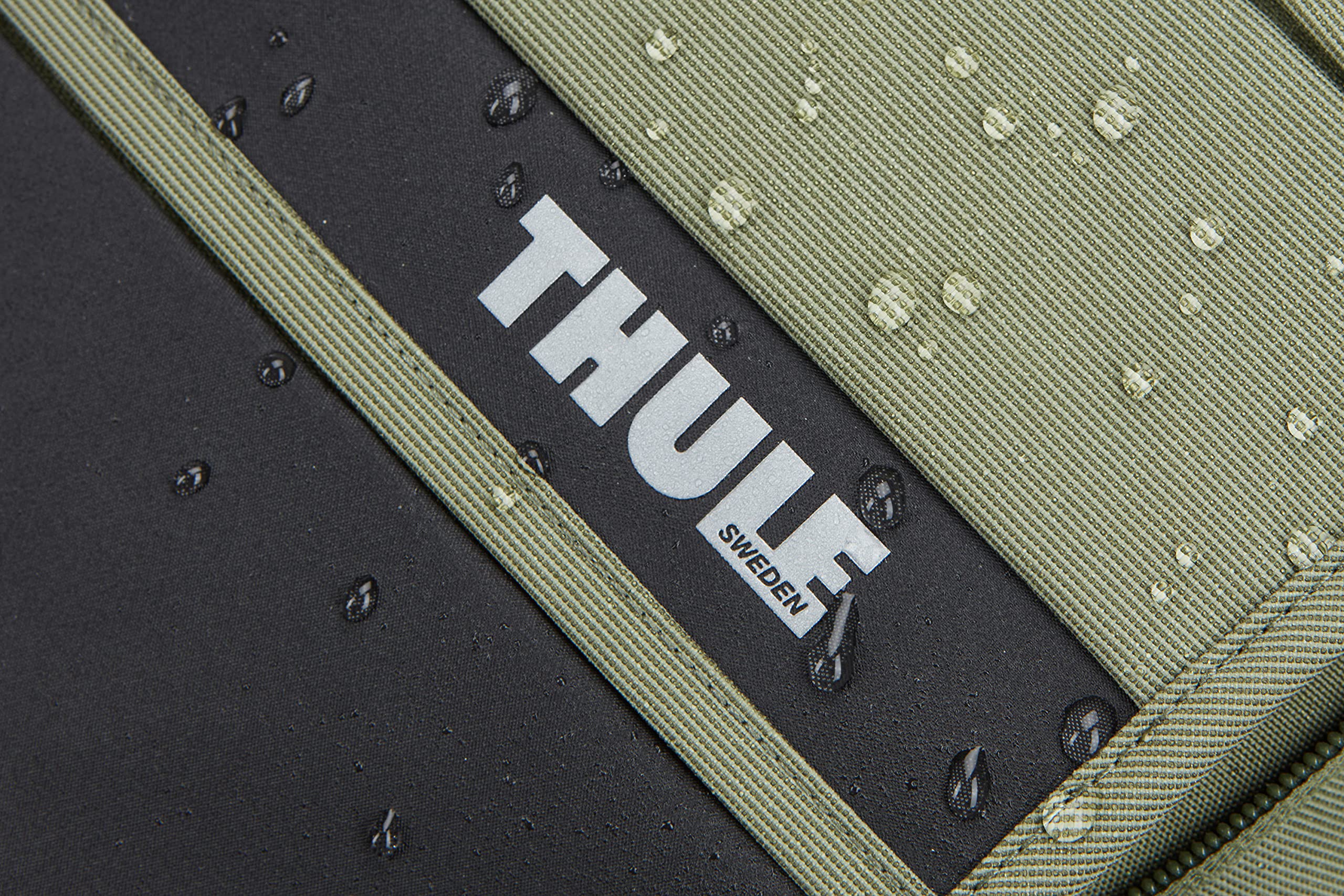 Thule Paramount Commuter Backpack 18L olive roll-top closure in action