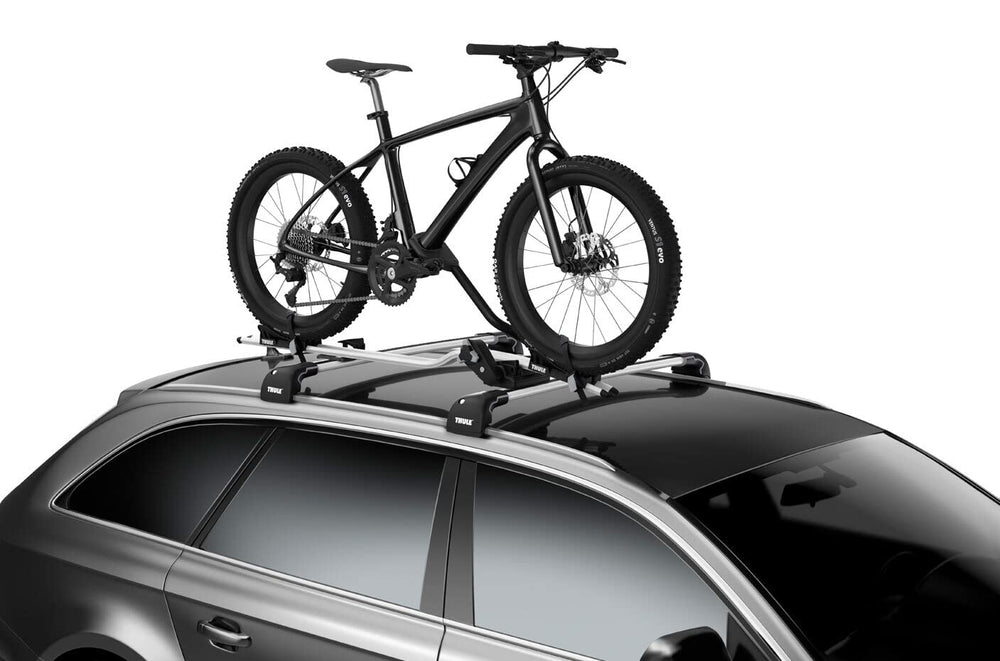 Thule Proride fat bike adapter in use on carrier during transit.