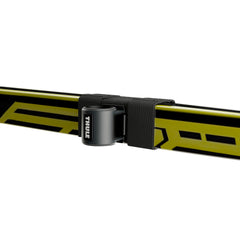 Ski strap and lock on Thule SkiClick 7291 securing skis for transport.
