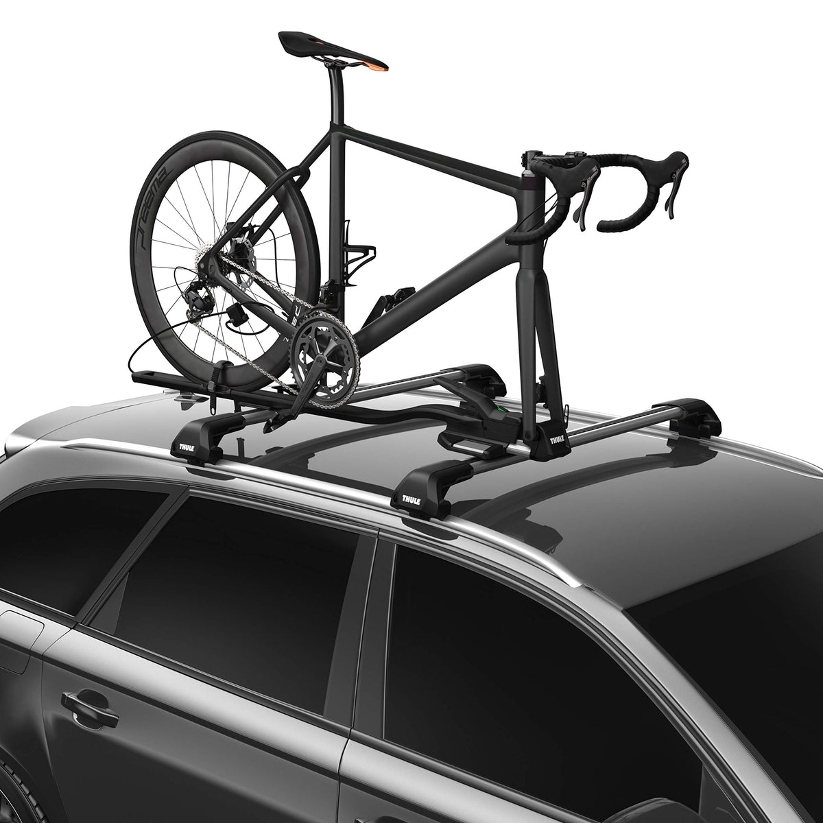 Thule TopRide fork-mounted bike carrier on car roof secures quick-release bikes.