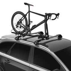 Thule TopRide fork-mounted bike carrier on car roof secures quick-release bikes.