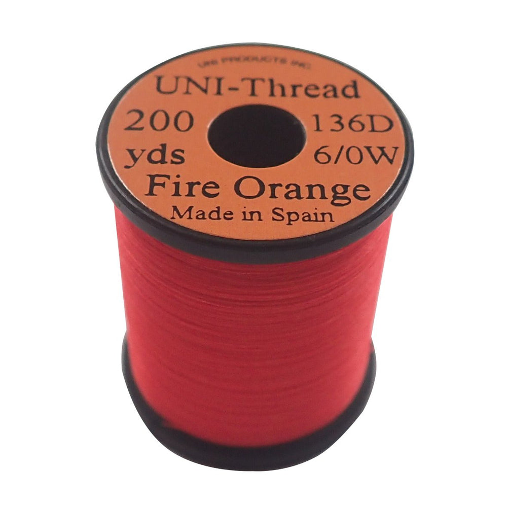 TIEMCO UNI thread in Fire Orange for secure wraps on standard-size flies.
