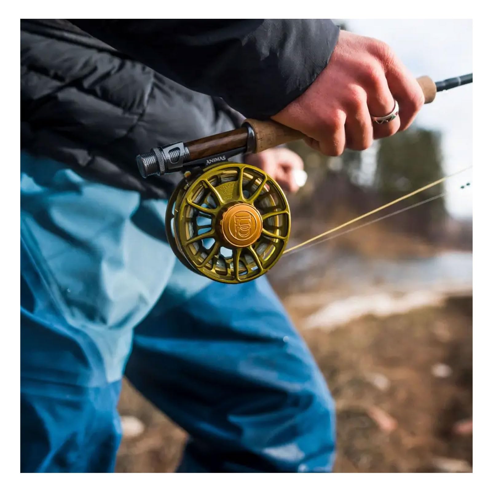 TIEMCO Ross Animus Matte Olive 4/5 Reel mounted on a rod with line