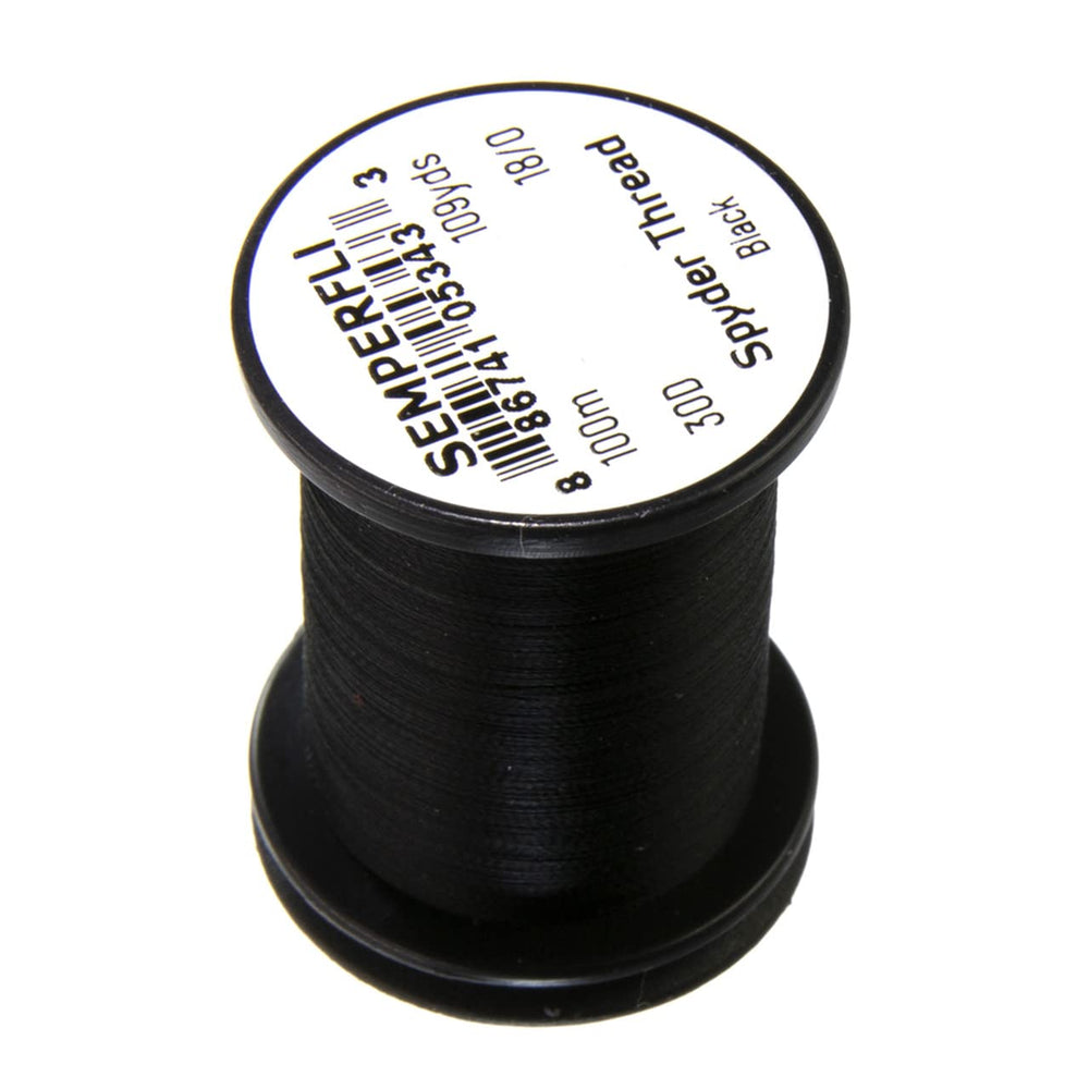 TIEMCO Spyder Thread 18/0 closeup shows translucent micro thread for delicate fly tying.