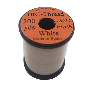 TIEMCO Uni Thread 6/0 white spool for durable, consistent fly tying wraps.