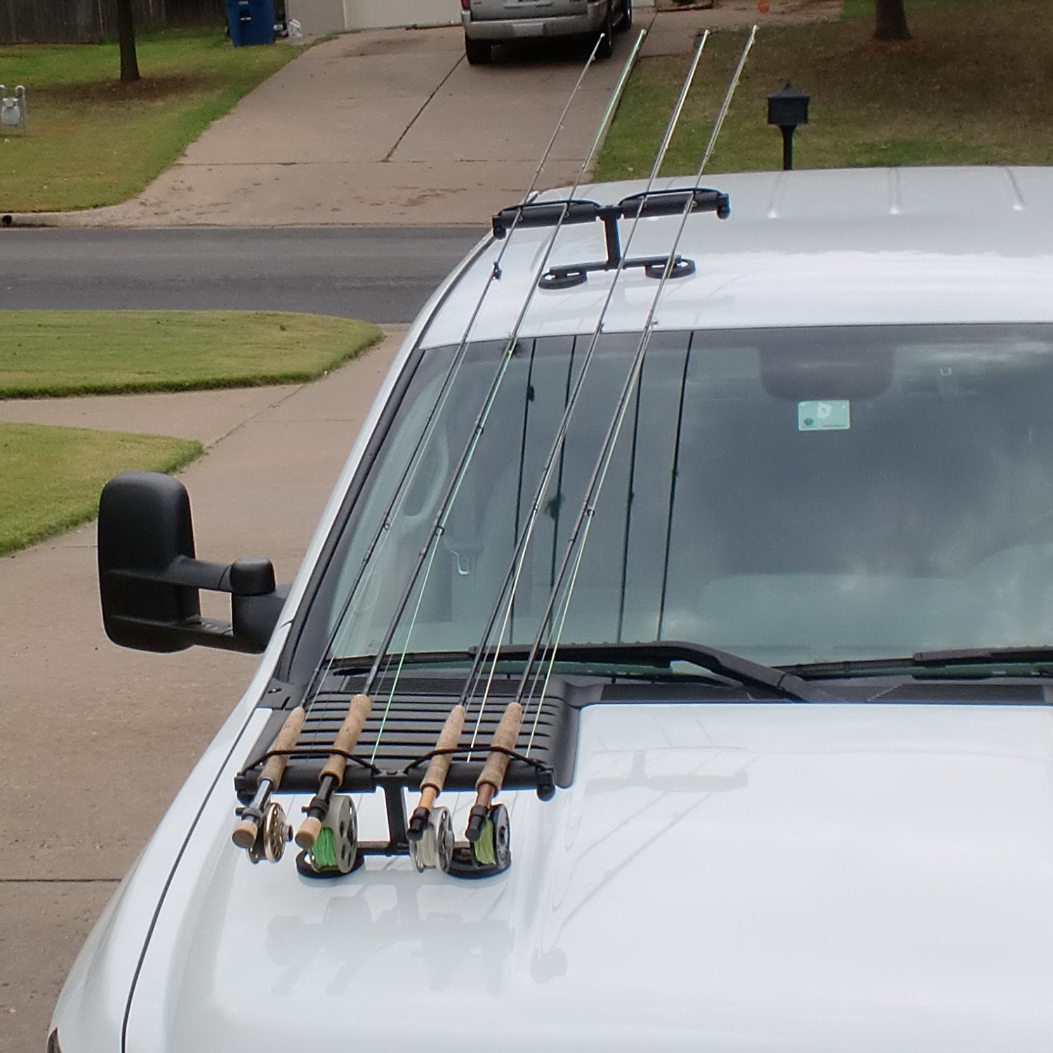 Tight Line Enterprises magnetic rod rack mounted on vehicle hood for secure transport.