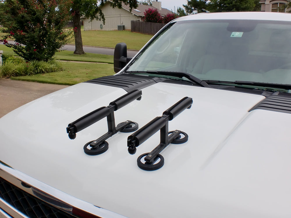 Bungee cord tie downs securing rods to the rack