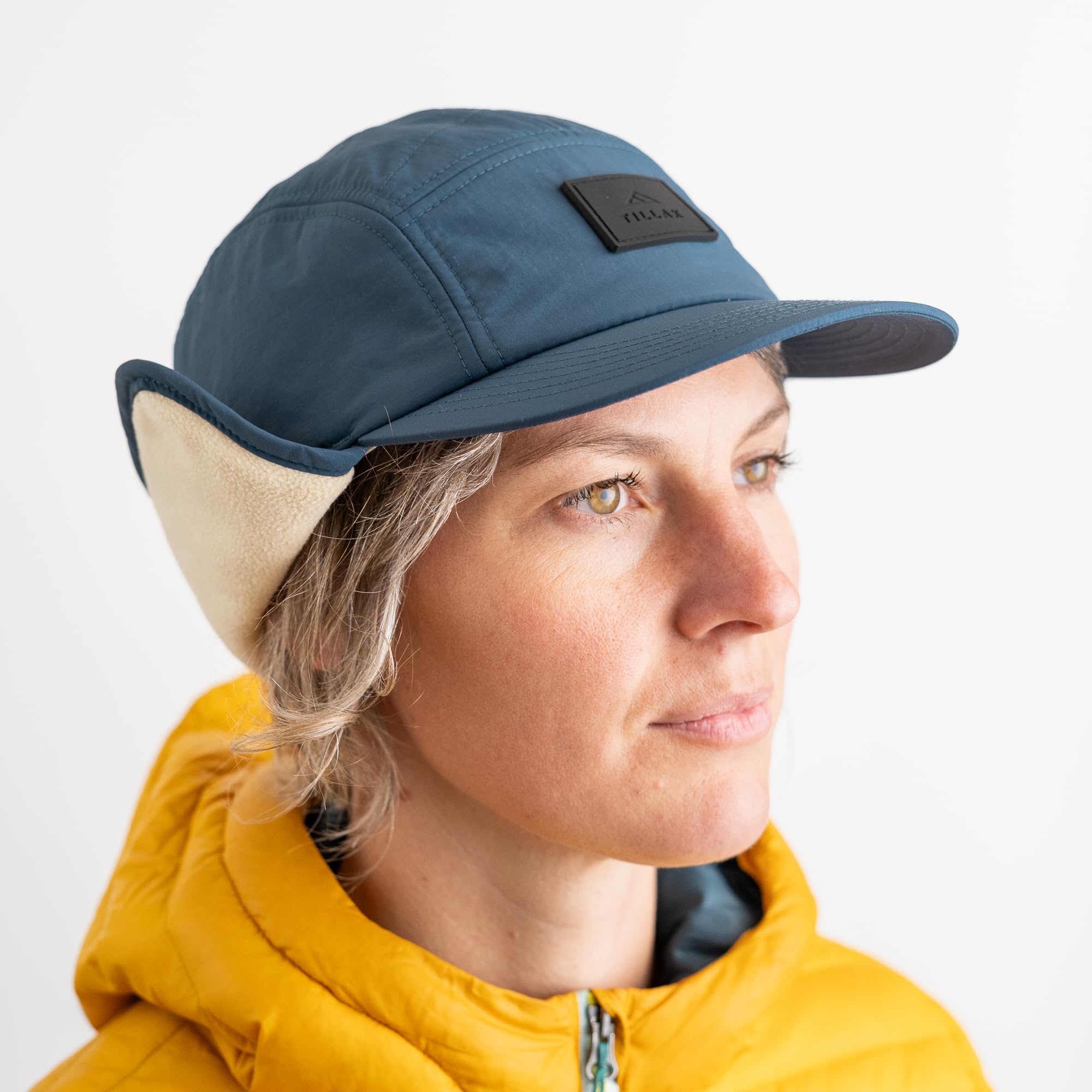 Tillak Tahoma Hat earflaps down demonstrating full insulation in cold conditions