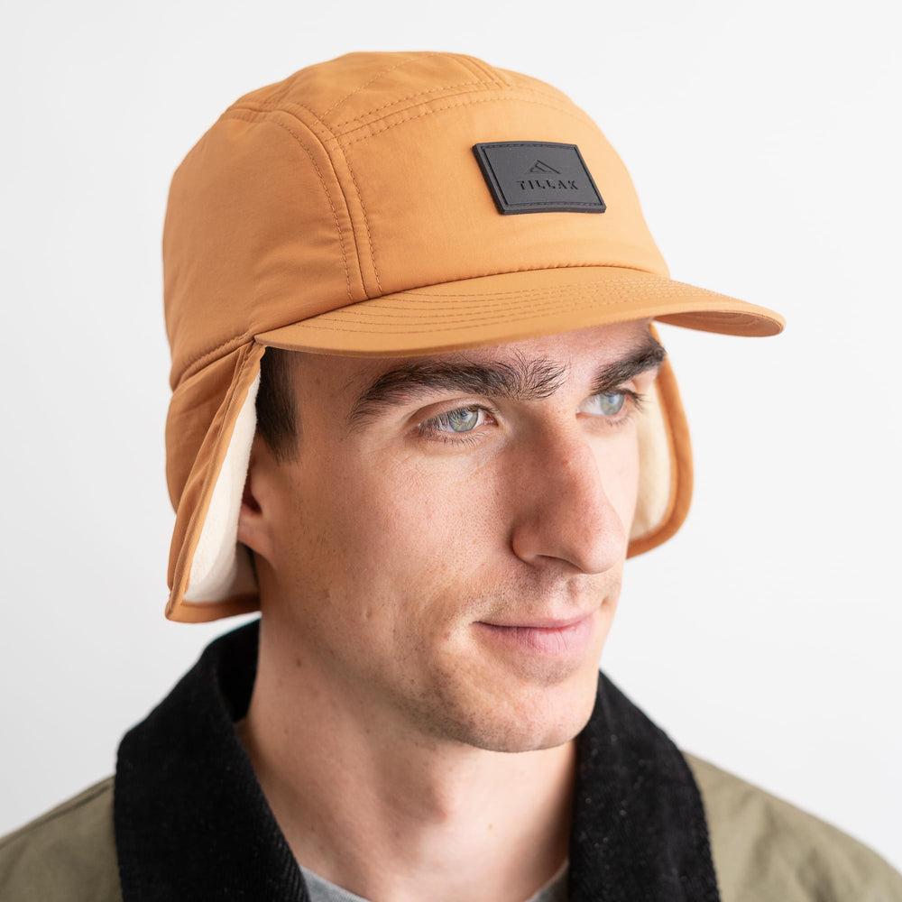 Tillak Tahoma Hat earflaps flipped up or down for warmth.