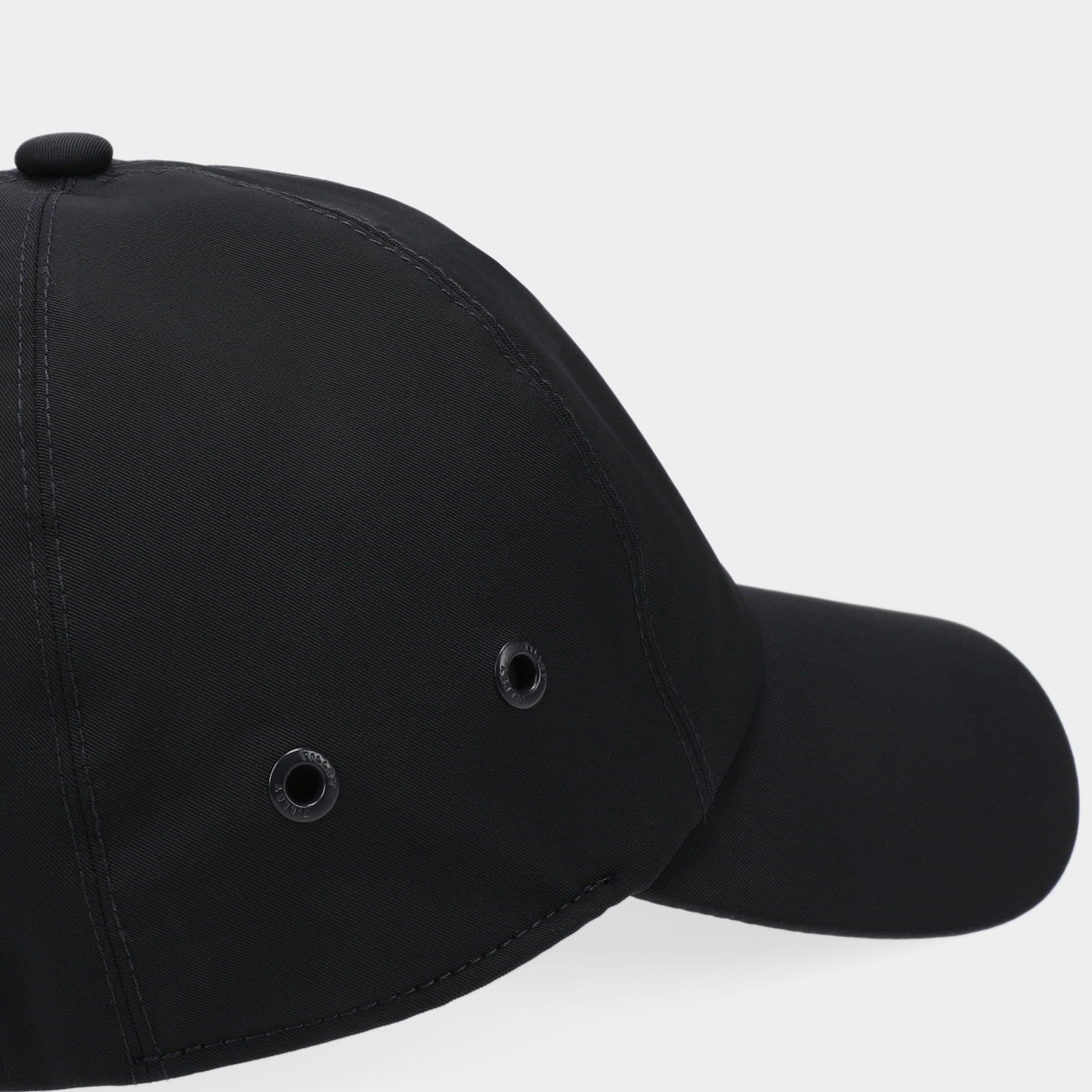 Tilley cap navy with matching accessories for a cohesive travel outfit.